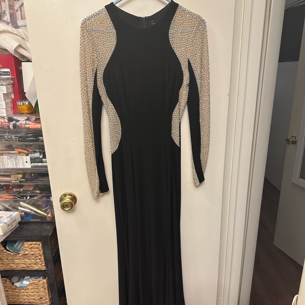 Xscspe gown. Black with beading on sleeves. Worn once. Size 4